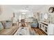 Inviting living room with wood floors flows into dining area and bright kitchen, great for entertaining at 25100 Sandhill Blvd # R201, Punta Gorda, FL 33983