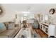 Inviting living room with wood floors flows into dining area and bright kitchen, great for entertaining at 25100 Sandhill Blvd # R201, Punta Gorda, FL 33983