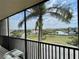 Enjoy the views from this screened balcony overlooking a serene canal and lush landscaping at 25188 Marion Ave # F304, Punta Gorda, FL 33950