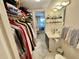 This bathroom offers a sink, toilet, and walk-in closet, conveniently located next to the primary bedroom at 25188 Marion Ave # F304, Punta Gorda, FL 33950