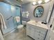 Bathroom featuring a shower and vanity with mirror at 25188 Marion Ave # F304, Punta Gorda, FL 33950