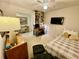 A serene bedroom with a cozy bed, workspace, and ample storage in a bright setting at 25188 Marion Ave # F304, Punta Gorda, FL 33950