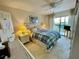 Cozy bedroom with sliding glass doors and serene outdoor views at 25188 Marion Ave # F304, Punta Gorda, FL 33950