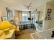 Comfortable bedroom with ample natural light and sliding glass doors to the balcony at 25188 Marion Ave # F304, Punta Gorda, FL 33950