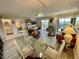 View of open living space showing dining area, living room and entrance to hall at 25188 Marion Ave # F304, Punta Gorda, FL 33950