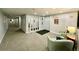 Hallway with elevator access, seating, and mirrored accents creating a bright and stylish entrance to the apartments at 25188 Marion Ave # F304, Punta Gorda, FL 33950