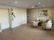 Lobby with tile flooring, comfortable seating, and beach-themed artwork for a welcoming atmosphere at 25188 Marion Ave # F304, Punta Gorda, FL 33950