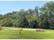 Practice your short game on this well-kept putting green surrounded by lush landscaping at 25188 Marion Ave # F304, Punta Gorda, FL 33950