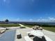 Enjoy the lovely weather near the pier sitting on a white concrete picnic table and benches at 25188 Marion Ave # F304, Punta Gorda, FL 33950
