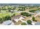 Aerial view of the condo shows lush green golf course, surrounding community, and convenient parking at 26461 Explorer Rd # F, Punta Gorda, FL 33983
