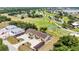 Aerial view of the property with a golf course in the background at 26461 Explorer Rd # F, Punta Gorda, FL 33983