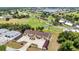 Aerial view of condo showing nearby golf course and landscaping at 26461 Explorer Rd # F, Punta Gorda, FL 33983