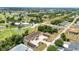Scenic aerial view of condo building near lush green golf course offering a serene lifestyle at 26461 Explorer Rd # F, Punta Gorda, FL 33983