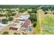 An aerial view of the home highlighting the pool, carport, and proximity to a recreational field at 26461 Explorer Rd # F, Punta Gorda, FL 33983