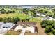Scenic aerial shot of condo featuring lush landscaping, golf course, and ponds nearby at 26461 Explorer Rd # F, Punta Gorda, FL 33983