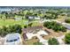 Aerial image features of a building next to a well maintained golf course community with water features at 26461 Explorer Rd # F, Punta Gorda, FL 33983