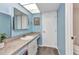 Bathroom with sink and vanity, access to the toilet and walk-in shower at 26461 Explorer Rd # F, Punta Gorda, FL 33983