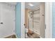 Bathroom with toilet and walk-in shower with glass enclosure at 26461 Explorer Rd # F, Punta Gorda, FL 33983
