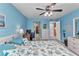 Spacious bedroom showcasing an ensuite bathroom and a peak into a walk-in closet at 26461 Explorer Rd # F, Punta Gorda, FL 33983
