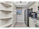 Bright kitchen featuring white cabinets, stainless steel appliances, and ample storage space at 26461 Explorer Rd # F, Punta Gorda, FL 33983