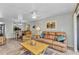 Open-concept living area with comfortable seating, tile flooring, and access to other spaces at 26461 Explorer Rd # F, Punta Gorda, FL 33983