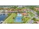 Aerial view of a luxurious community featuring a pool, tennis court, marina and beautiful tile roof homes at 303 11Th E Ave, Palmetto, FL 34221