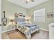 Well-lit bedroom with wood floors, a decorative headboard, and bright colors at 303 11Th E Ave, Palmetto, FL 34221