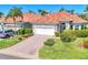Stunning exterior view of a single-Gathering home with tile roof, well-manicured lawn, and brick-paved driveway at 303 11Th E Ave, Palmetto, FL 34221