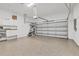 Clean and spacious two-car garage with epoxy floors and storage cabinets at 303 11Th E Ave, Palmetto, FL 34221
