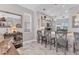 Bright kitchen features marble floors, gray cabinetry, a breakfast bar and modern pendant lighting at 303 11Th E Ave, Palmetto, FL 34221