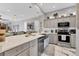 Contemporary kitchen featuring a large island, stainless appliances and elegant pendant lighting at 303 11Th E Ave, Palmetto, FL 34221