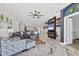 Spacious open living room features stylish decor, ample natural light, and seamless access to the kitchen area at 303 11Th E Ave, Palmetto, FL 34221