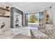Relaxing living room features an accent wall, comfortable seating, and sliding glass doors to the outdoor patio at 303 11Th E Ave, Palmetto, FL 34221