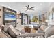 Cozy living room features a fireplace, marble floors, modern decor, and sliding glass doors that lead to the outdoor patio at 303 11Th E Ave, Palmetto, FL 34221