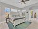 Main bedroom with ceiling fan, bright windows, and neutral decor at 303 11Th E Ave, Palmetto, FL 34221