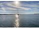 Serene image featuring a sailboat on the tranquil water and a captivating sky. Perfect for relaxing days at 303 11Th E Ave, Palmetto, FL 34221