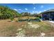 This home has a large backyard with a raised garden, patio and lanai space at 4097 Rose Arbor Cir, Port Charlotte, FL 33948