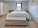 Serene bedroom featuring a comfortable bed, storage bench, and neutral tones at 4097 Rose Arbor Cir, Port Charlotte, FL 33948