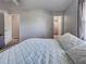 Bright bedroom featuring plush pillows, and access to both a closet and an en-suite bathroom at 4097 Rose Arbor Cir, Port Charlotte, FL 33948