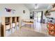 Dining area featuring tile floors, a table and bench, and built-in shelving at 4097 Rose Arbor Cir, Port Charlotte, FL 33948