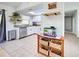This kitchen has tile floors, stainless steel appliances and great natural light at 4097 Rose Arbor Cir, Port Charlotte, FL 33948
