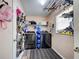 Functional laundry room with washer, dryer, and organizational shelving at 4097 Rose Arbor Cir, Port Charlotte, FL 33948