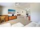 Spacious living room with a ceiling fan and easy access to the dining area at 4097 Rose Arbor Cir, Port Charlotte, FL 33948