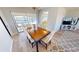 Dining room with dark wood table that walks out to pool area, features a chandelier and wood flooring at 425 Belvedere Ct, Punta Gorda, FL 33950