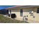 Home exterior featuring modern pool equipment and manicured lawn at 425 Belvedere Ct, Punta Gorda, FL 33950