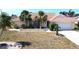 Inviting single Gathering home with a well-maintained yard, palm trees, and a tile roof at 425 Belvedere Ct, Punta Gorda, FL 33950