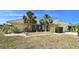 Inviting single Gathering home with a well-maintained yard, palm trees, and a tile roof at 425 Belvedere Ct, Punta Gorda, FL 33950