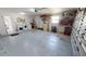 Spacious garage with laundry area, storage shelves, and access to the house at 425 Belvedere Ct, Punta Gorda, FL 33950