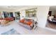 Relaxing lanai with comfortable seating, tiled floor, and views of the home at 425 Belvedere Ct, Punta Gorda, FL 33950