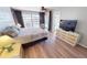 Comfortable bedroom with a walk-out to the backyard pool at 425 Belvedere Ct, Punta Gorda, FL 33950